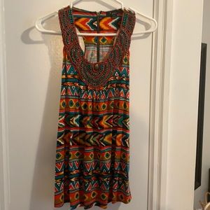 Colourful shirt with detailed beading.